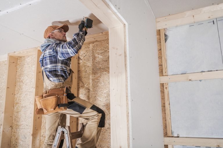 Handyman installing drywall and framing in a Baton Rouge home